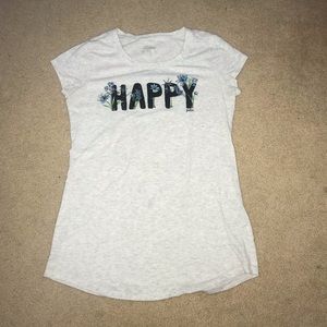 “Happy” Tan Justice shirt.